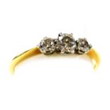 A 9ct gold and diamond three stone ring, approximately 0.2ct, size H, 1.7g.