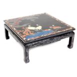 A Chinese square black lacquer coffee table, painted with cranes, trees, and flowers, raised on squa