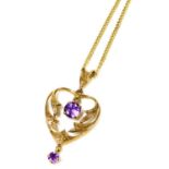 An Art Nouveau style 9ct gold and amethyst heart shaped pendant, 2.8g, on a curb link neck chain, wi