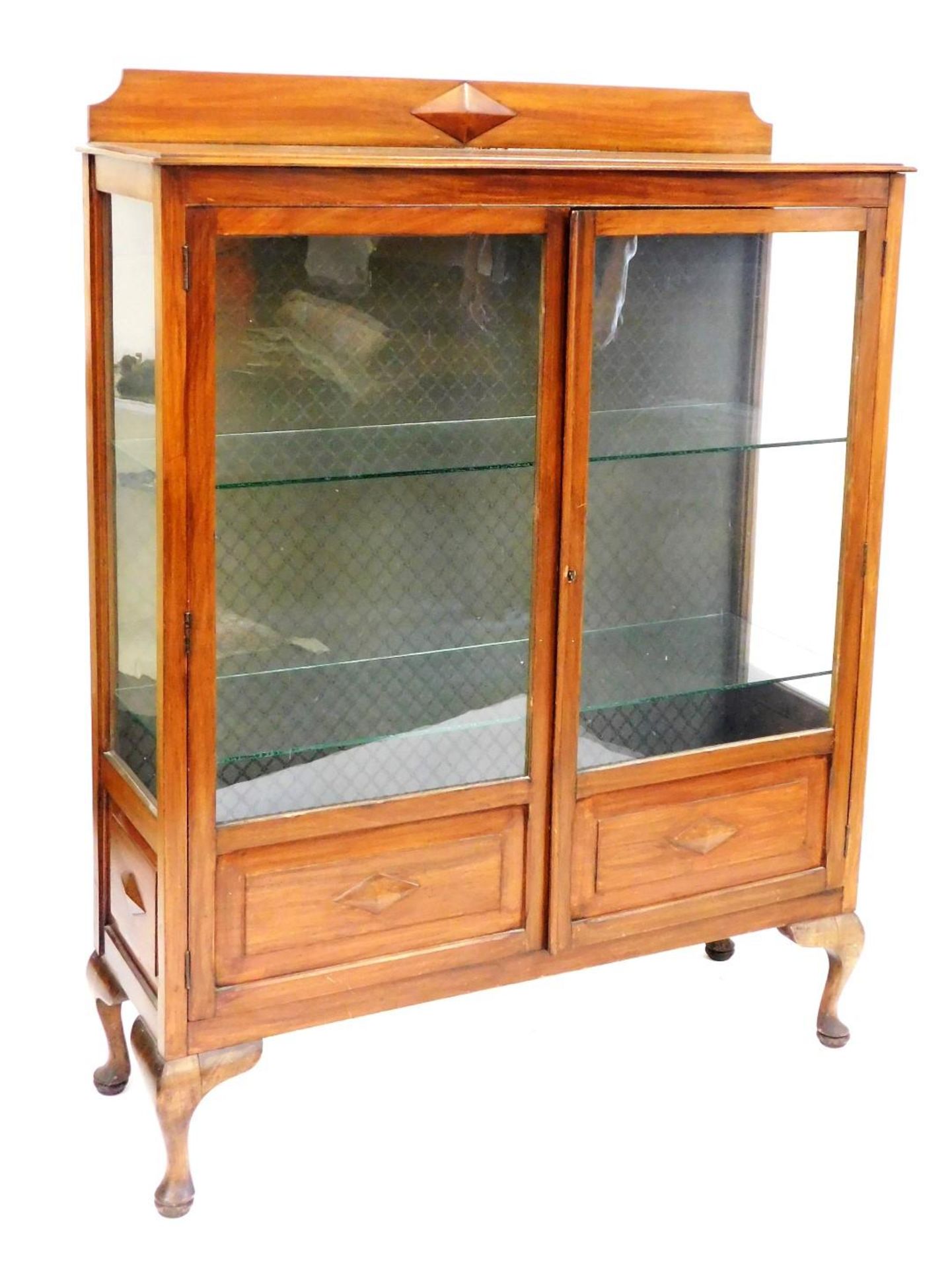 An early 20thC mahogany display cabinet, with a pair of glazed doors enclosing two glass shelves, ra