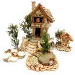 A Pendelfin model of The Large House, together with Cobble Cottage, picnic stand with campfire, and