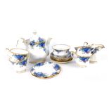 A Royal Albert porcelain part tea service decorated in the Moonlight Rose pattern, comprising teapot