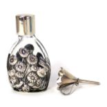 A silver scent bottle, by Arid Norman, in a fitted case, London 1974.