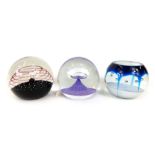 Three glass paperweights, comprising a Caithness Space Beacon, 488/500, Caithness Illusions, 406/100