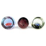 Three glass paperweights, comprising Caithness Fish on Reef 326/1500, Caithness Purple Bird of Parad