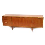 A mid century A H McIntosh Ltd. teak sideboard, the rectangular top above two doors, flanked by a fa
