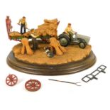 A Country Artists figure group, modelled as a farming scene of men with hay, 30cm wide. (AF)