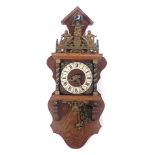 A Dutch Zaandam wall clock, in oak case, the brassed crest with slogan Nu Elck Syn.Sin, etc., 66cm h