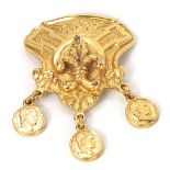A Kasoff pendant, of scroll and fleur de lys form, with three coin drop, made for Estee Lauder, 5cm