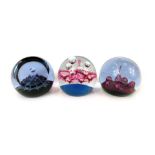 Three glass paperweights, comprising Caithness Atlantis, 269/1500, Mountains of Mars, 594/750, and S