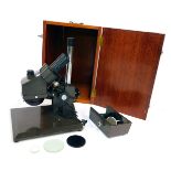 A Swift microscope, serial no 7825140, in fitted case, 44cm high, 30cm wide, 32cm deep. (AF)