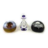 Three glass paperweights, comprising a Selkirk glass unmarked paperweight, Caithness Night Venture,