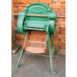 A Vipan and Headly of Leicester number 3 beet cutter, green painted metal, with red wooden shelf, 97