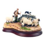 A Border Fine Arts sheep figure group, comprising Off The Fell, B1040, on shaped wooden base, 25cm w