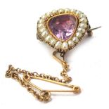 An Edwardian brooch, of pear shaped form, with blister pearl outer border and central pink topaz, in