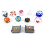 A collection of small glass paperweights, comprising two Caithness miniature Millefiori paperweights