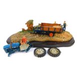 A Country Artists figure group, modelled as a farming scene with tractors, on a wooden base, 55cm wi