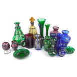 A group of Bohemian coloured glassware, each piece decorated with flowers, other foliate motifs, to