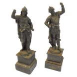 A pair of 19thC Continental spelter figures, modelled as 18thC figures in armour, surmounted on grad