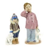 A Lladro figure of a boy in winter clothing with Polar Bear, 15cm high, and a Nao figure of a young
