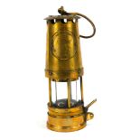 A Protector Lamp & Lighting Company Eccles miners lamp, JCM1, No 117, 24cm high, with swing handle.
