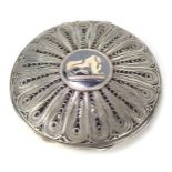 A Middle Eastern white metal powder compact, the filigree lid with niello engraving of Birds of Para