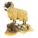 A Teviotdale sheep figure, on rock and heather base, 13cm high.