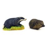 An Aynsley badger matt porcelain figure, 16cm wide, and a Poole hedgehog. (2)