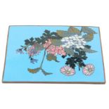 A Chinese cloisonne panel, of rectangular form, on a blue ground with floral sprays of pink flowers,