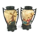 A pair of Embrosa pottery two handled vases, decorated in relief with figures before windmills, stam