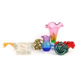 A collection of Art glass, including a rainbow flared rim trumpet vase, 25cm high, swirl glass balls