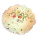 A Royal Worcester blush porcelain plate, with petallated border, decorated centrally with flowers, p