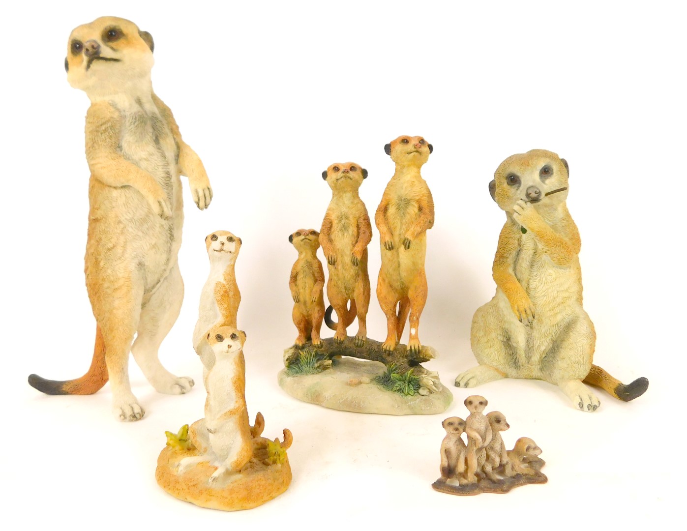 Meerkat figures, comprising a Leonardo Collection three Meerkats figure group on branch, 15cm high,
