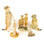 Meerkat figures, comprising a Leonardo Collection three Meerkats figure group on branch, 15cm high,