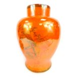 A Carltonware orange lustre jar and cover, of large proportions with dog of fo handle and hand paint