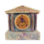 A 19thC green onyx and gilt metal mantel clock, the brass Roman numeric dial with brass chapter ring