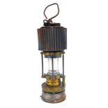 A Patterson Lamps miners lamp, with swing handle, 30cm high.