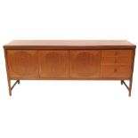 A mid century Nathan teak sideboard, the top with a rounded edge above two doors flanked by a fall,