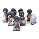 Seven Robertsons figures, together with a Noddy and Policeman ceramic figure. (AF)