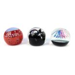 Three glass paperweights, comprising Caithness Fireworks 69/500, Black Gem 674/1000, Nucleus 224/150