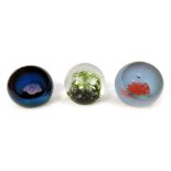 Three glass paperweights, comprising Caithness North Sea 902/1000, Triad 294/1500, and Tranquility 1
