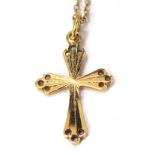 A 9ct gold crucifix pendant and chain, the crucifix with pierced design ends, 2.5cm high, on fine li