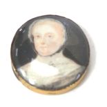 A 19thC portrait miniature, of lady in lace evening dress, in a gilt metal frame, 3cm x 2.5cm.