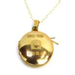 A 9ct gold Queen Elizabeth II oval locket, on fine link chain, the locket depicting figure of Elizab