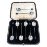 A matched set of eight George V silver bean handled coffee spoons, Birmingham 1924, in fitted case f