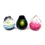 Three glass paperweights, comprising Caithness Serenity 187/500, Volcano 276/650, and Labyrinth 114/