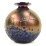 A 20thC Maltese iridescent Phoenician glass vase, of globular form with flared neck, signed to under