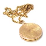 A 9ct gold circular pendant and chain, the circular locket with engine engraved outer case, 3cm wide