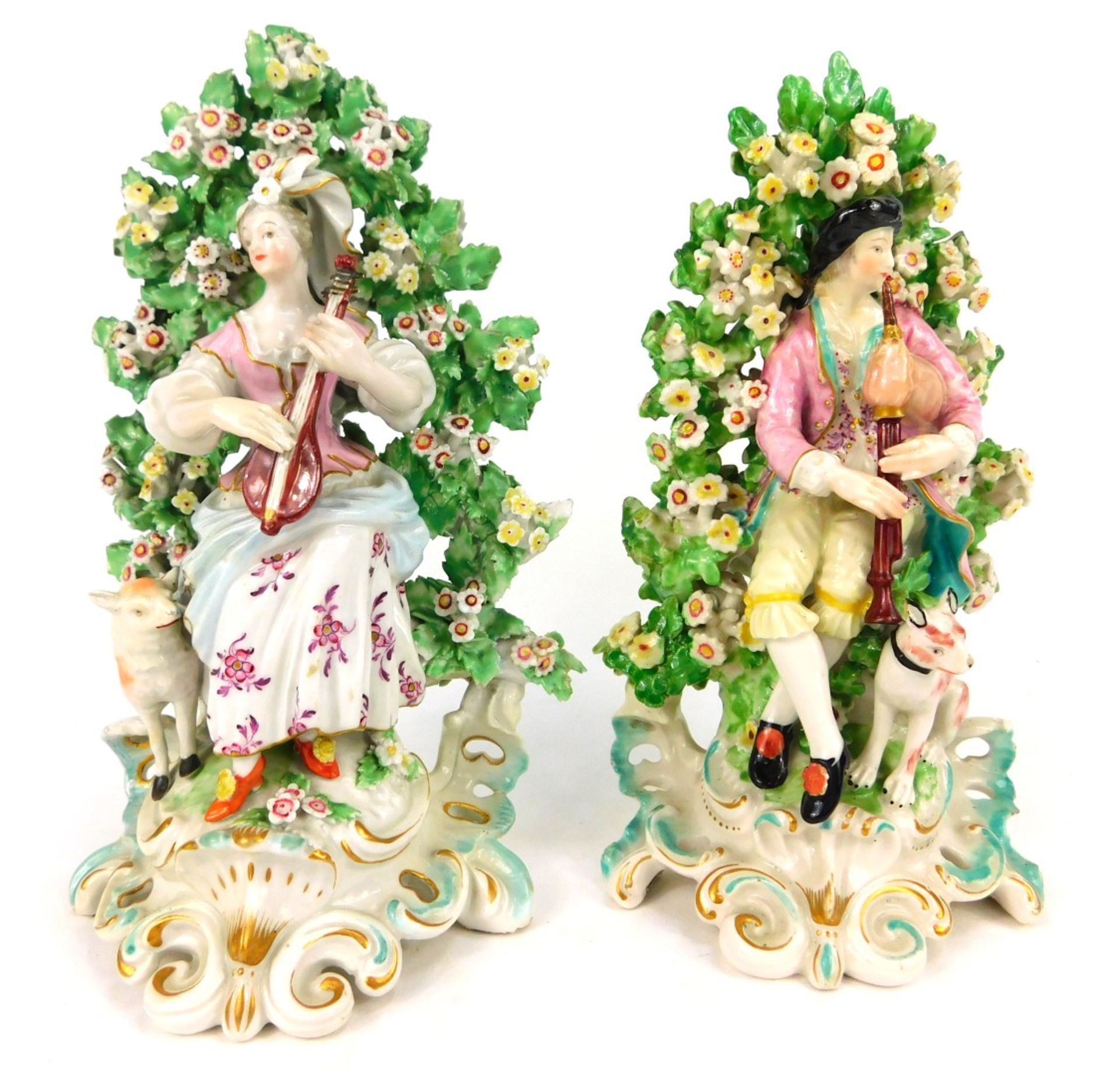 A pair of 19thC Continental porcelain figure groups in Derby style, depicting male and female playin