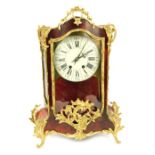 A French tortoiseshell and gilt brass mounted bracket clock, with a Roman numeric and canted white